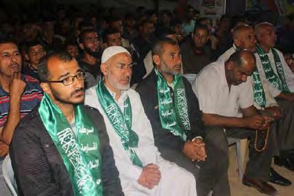 (second from left), Saadi's uncle and a released prisoner, at the service