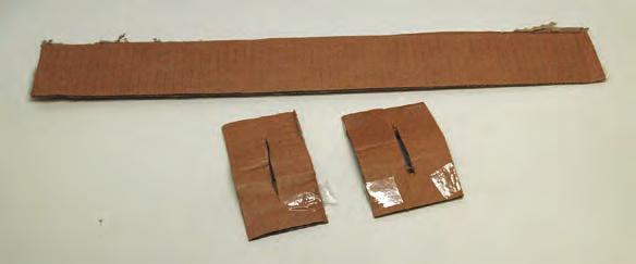 Fold each strip in half and make a cut down the middle of each fold. Place strips on opposite sides of bottom of ark.
