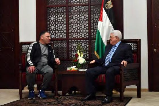 3 Right: Mahmoud Abbas meets with Fatah operative Rajaa'i Hadad after his release from an Israel jail during a reception held in Abbas' office in Ramallah (Wafa,