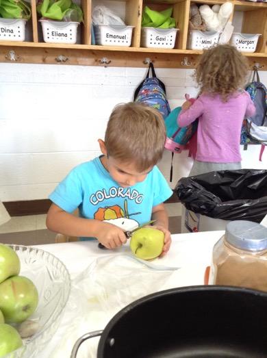 The children took turns as they washed their hands, sat at the table and began peeling or cutting. I know how to peel.