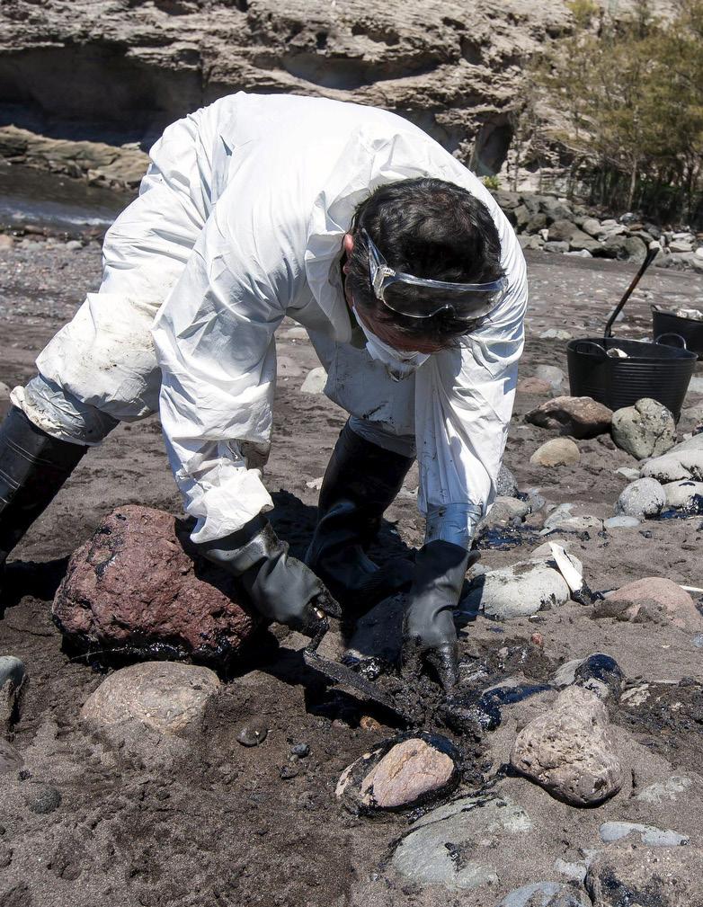 6 NCRONLINE.ORG NATIONAL CATHOLIC REPORTER CNS/Reuters/Borja Suarez A man collects fuel oil from rocks in April 2015 following an oil spill along Veneguera beach in Spain s Canary Islands. 3.