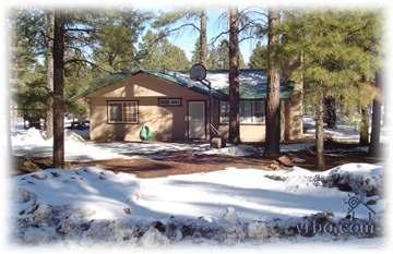 Welcome to our beautiful vacation rental featuring great indoor and outdoor spaces surrounded by tall pines.