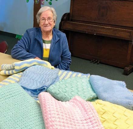 Every Fall, Roseann Saliba makes a plea to the Tuesday Bible Study group for handmade blankets and caps to be shipped to the