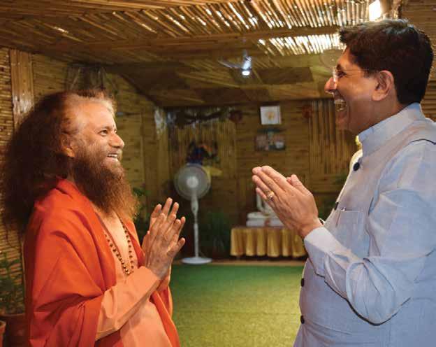 31 1 2 3 Shri Piyush Goyal, Minister of Railways, Government of India shares a special moment with Pujya Swamiji during his visit to Parmarth.