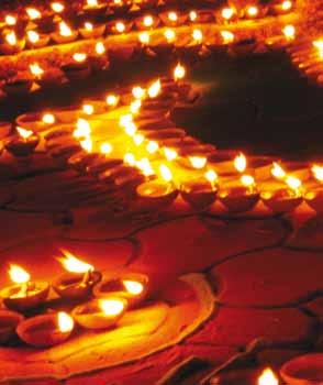 People wear new clothes and light clay lamps, called diya, which they place in their homes to encourage the goddess Lakshmi to visit and bring prosperity and good luck.
