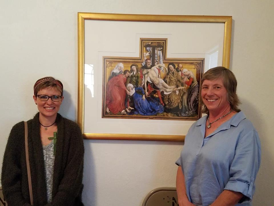 Jessica Hughes Hill (left) and Linda Wilkins Klein Stand smiling beside the picture that they gave. Ours is a happy congregation with stability and orthodoxy.