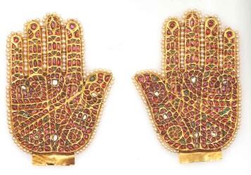No JLY 1923 Amulets in the shape of the hand of Fatima India, possibly Hyderabad Max Height: 118 mm Gold on a lac core, rubies,