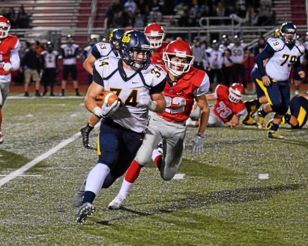 Upper Perkiomen s Tyler Whary takes a carry around the right end against Owen J. Roberts Friday.