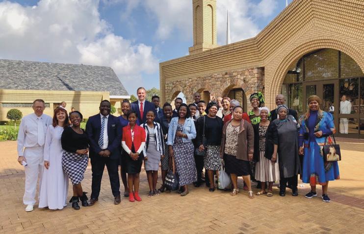 Elder and Sister Foote with Church members at the Johannesburg Temple.