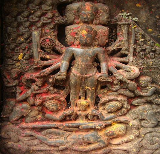 A Vishnu idol with ten heads and ten arms is a fine example of stone carving