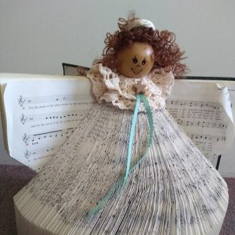 We still have a few adorable hymnal angels crafted out of the green LBW hymnals available for purchase ($12).