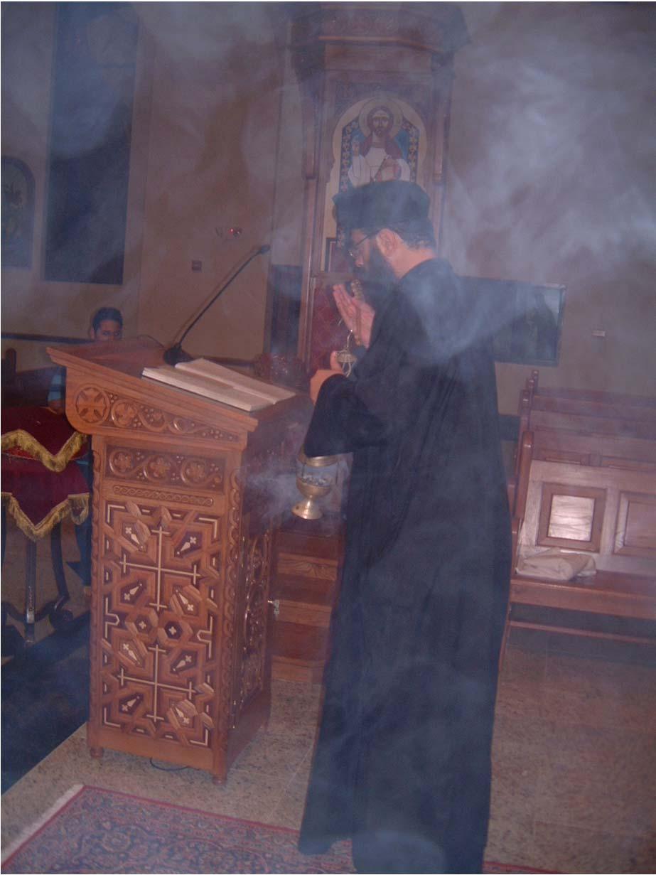 We notice that when the priest offers incense before the Gospel, he does this by putting