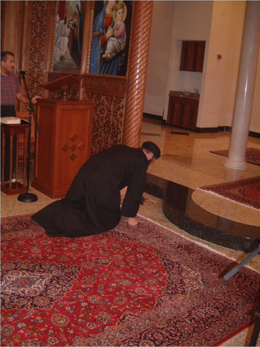 Then, the priest prostrates before the altar and before the