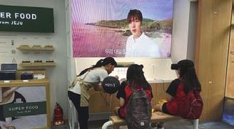 Culture Insight The customers engage in a virtual date with the Korean celebrity Lee Minho in the VR zone of Innisfree.