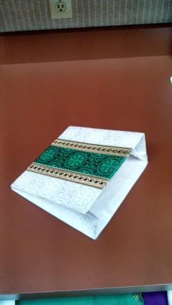 placed during Mass. This cloth is used to catch any particles of the Eucharist which may fall from the sacred host.