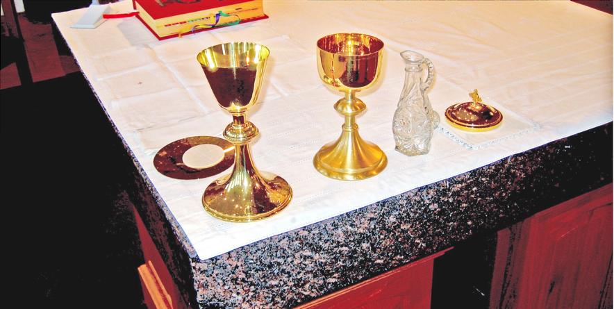 Altar set with chalice and book When the Priest or Deacon nods, proceed to the front of the