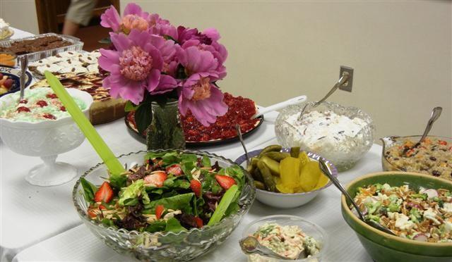 Sixty five women gathered bringing wonderful salads and desserts from their kitchens to share with each