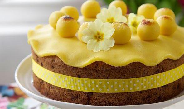 SIMNEL CAKE Simnel Cake is especially associated with Mothering Sunday, which this year falls on 6 March. It is a fruit cake with two layers of almond paste, one on top and one in the middle.