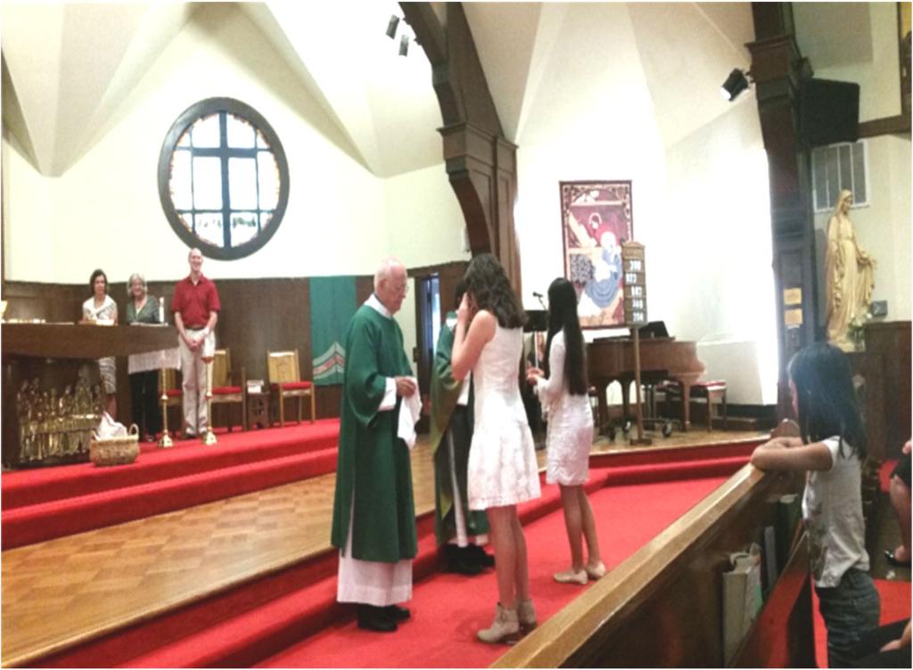 On Sunday, July 23 rd at the 10am mass we had two youths receive their First Communion.