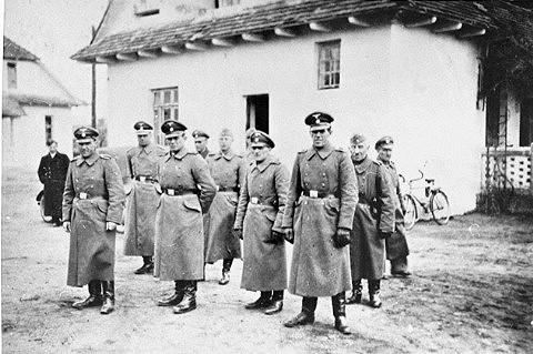 At Belzec death camp, SS Guards stand in