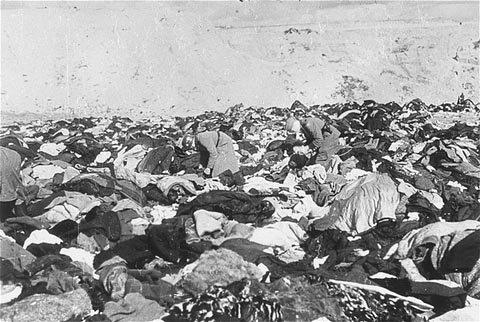 Nazis sift through the enormous pile of clothing