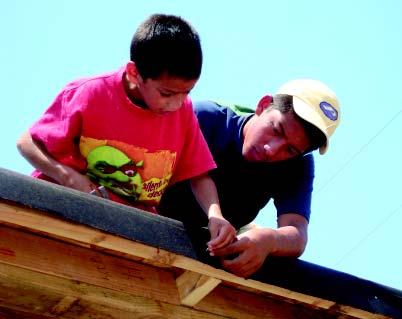 FALL 2008 Faith in Action In this section 21 Faith in Action Boys from St. Innocent Orphanage worked alongside volunteers from 25 US parishes to build seven homes.