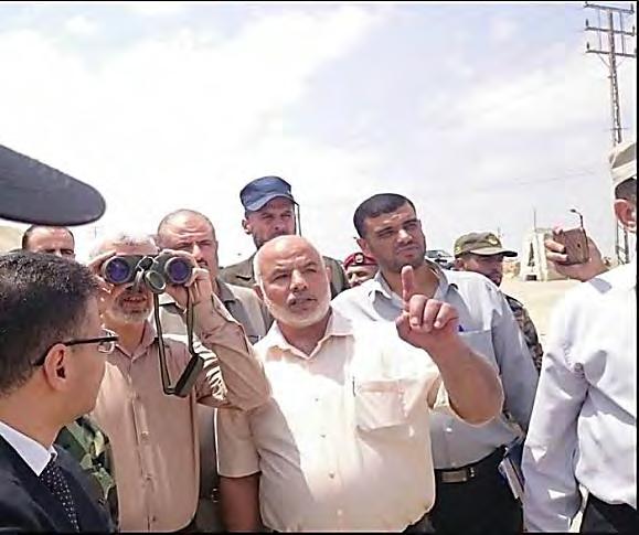 Tawfiq Abu Na'im, deputy minister of the interior in the Gaza Strip, holds a press conference near the construction site.