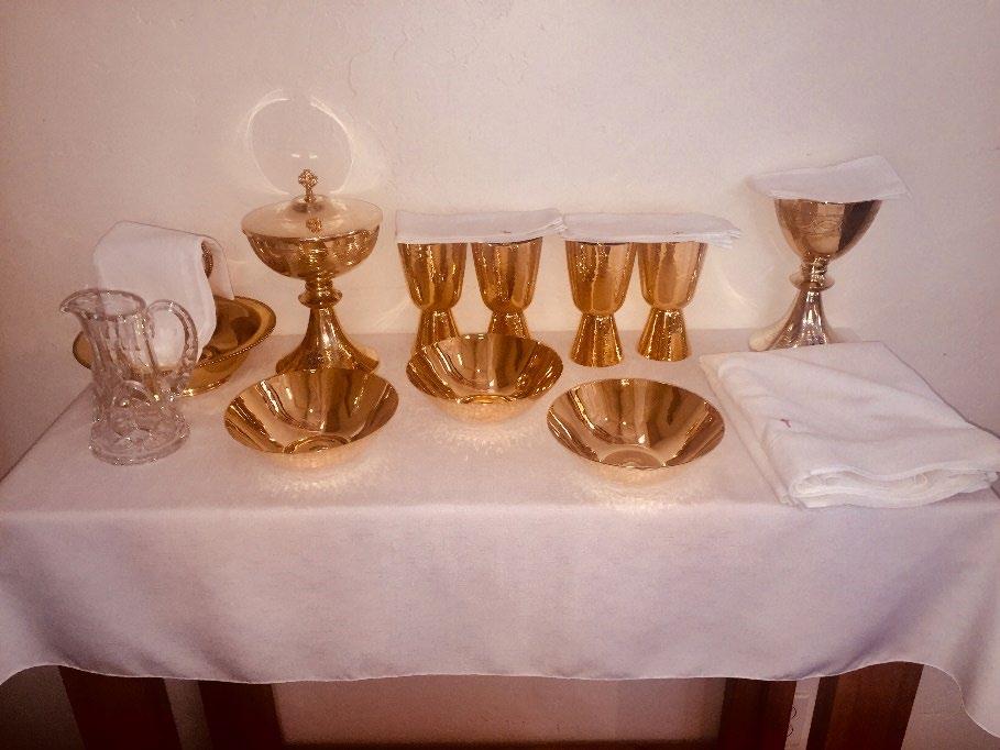 - Place the large Corporal (altar linen) and the Chalice, covered with a small Corporal, on the right edge of the table.