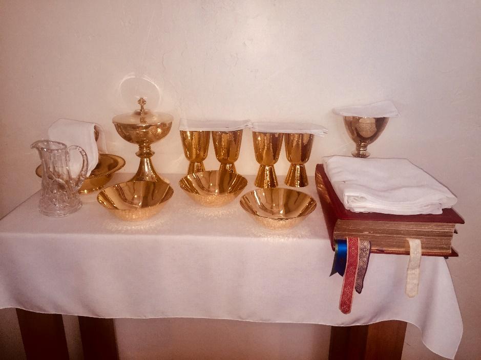 pitcher and hand towel for the washing of the priest s hands.