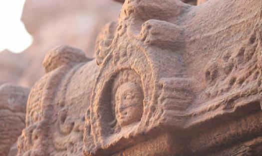 Several Nandi sculptures are seen along with a few broken lion sculptures.