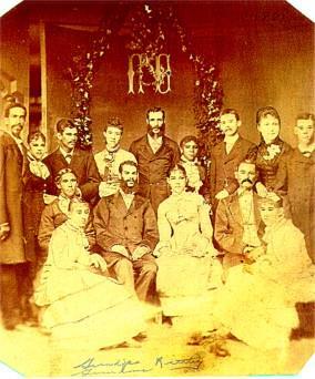 This photo was taken in the Baumgarten Studio presumably on June 6, 1881- --the date of the marriage of John Rattley to Sarah Butler.