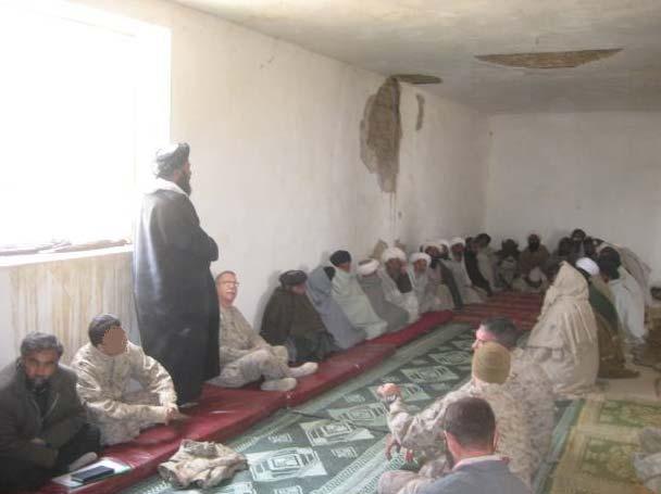 Chaplain Salam, Chaplain Pelikan and Director Mullah Mukhtar Haqqani in a Mosque with the mullahs of the town of Nowzad, Northern Helmand Province.