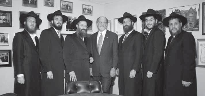 In the center, Rabbi Carlebach and the governor of NJ, John Corzine, on a visit to the Chabad house. The other men are shluchim to nearby cities and towns.