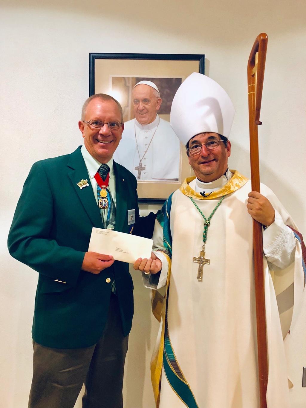 I received the Pennies For Heaven checks from the State Treasurer and I started to make plans with the Bishops' Offices to do the presentations.
