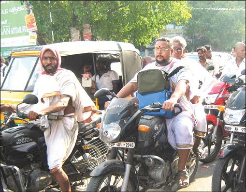 was slack as police and transport Though police made wearing of helmets compulsory for 2- wheeler riders