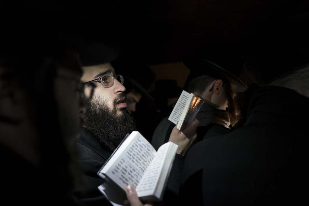 Hasidic Jews pray at the tomb