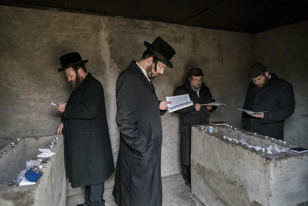 Hasidic Jews pray at the tombs of Grand Rabbi Aharon Twersky Admur of Chernobyl and Grand Rabbi Menachem Nachum Twersky Admur of Chernobyl.