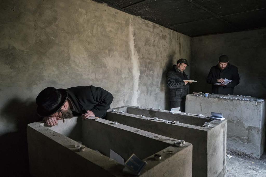 Hasidic Jews pray at the tombs of Grand Rabbi Aharon Twersky Admur of Chernobyl and Grand Rabbi Menachem Nachum Twersky Admur of Chernobyl. The latter was born in 1730 and died in Chernobyl in 1787.