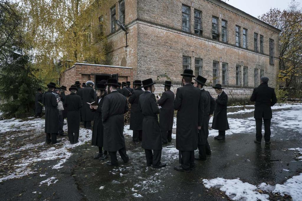Hasidic Jews in front of the tomb