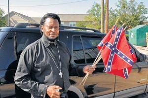 She said Dowdell, who denies snapping the flag, said Thursday he was picking up his daughter from Auburn Junior High School near the cemetery when several people told him they had a problem with the