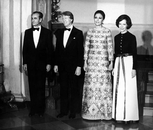 26 Hulton Archive. Getty Images. Used with permission. Shah Reza, President Jimmy Carter, Empress Farah, and First Lady Rosalyn Carter at the White House in 1977.