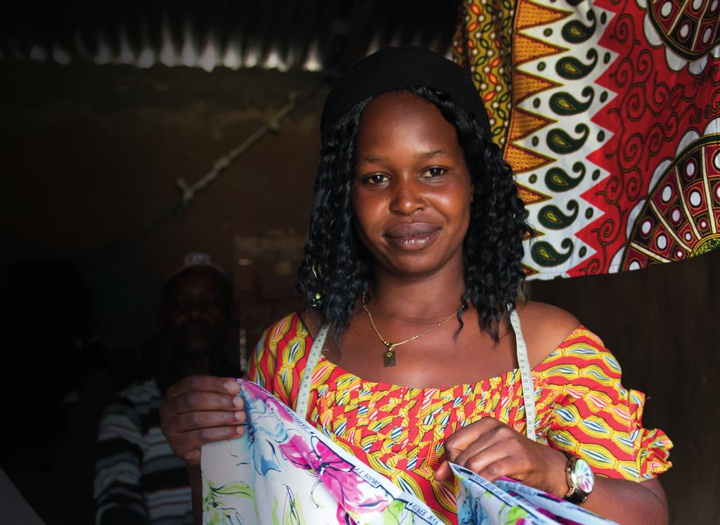 At the end of her training, our partner provided Birungi with a sewing machine, which she took home and used to start a business making clothes to sell. She sewed, she earned and she saved.