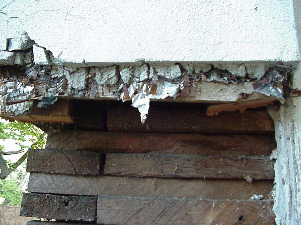 Detail of corner, stacked plank construction. Many of the properties have been altered in some fashion.