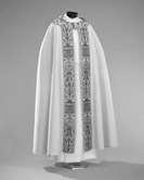 Cope: A long, elaborate cloak of colored silk or brocade worn by ministers at festival occasions. It has a clasp at the neck called a morse.