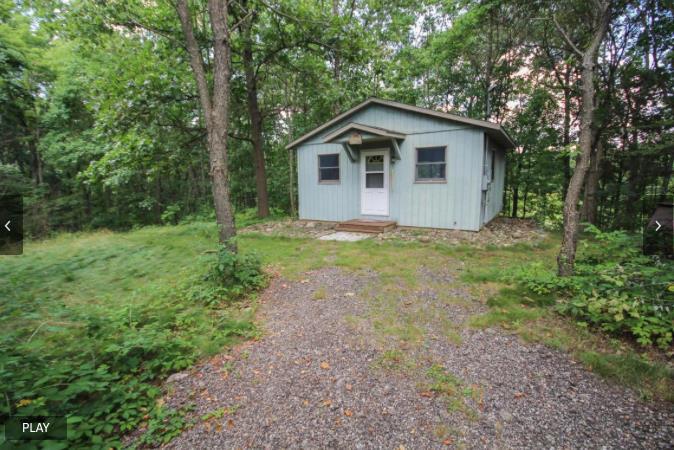 fireplace, new steel roof, pole barn, a cabin in the woods, plus ponds, meadows and