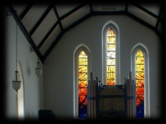 The stainedglass windows depicting The Blessed Virgin Mary and St