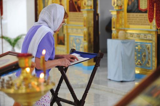 A woman praying in a Russian Orthodox church, Old Havana,