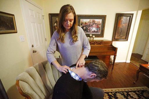 leaving behind taboos about the drug. (AP Photo/Rick Bowmer, File) Rebecca Frodsham points to her husband's surgical scars, at their home Monday, April 16, 2018, in Murray, Utah.