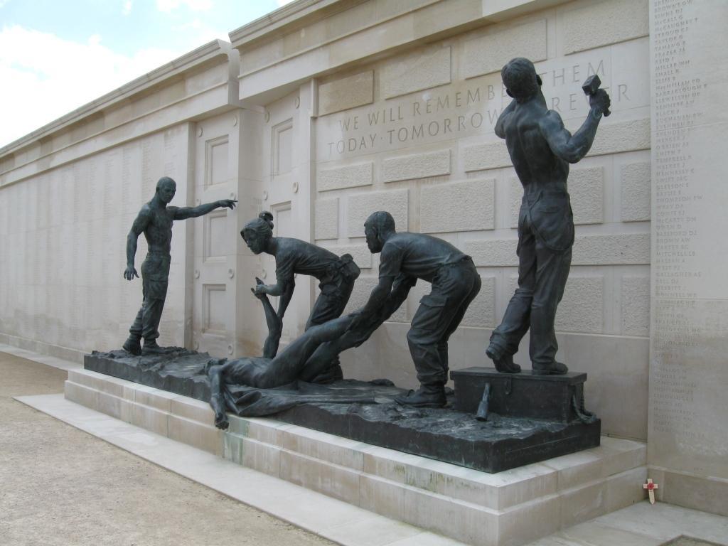 The centrepiece of the Memorial is two large bronze sculptures, representing loss and sacrifice. A serviceman is raised aloft on a stretcher by comrades.