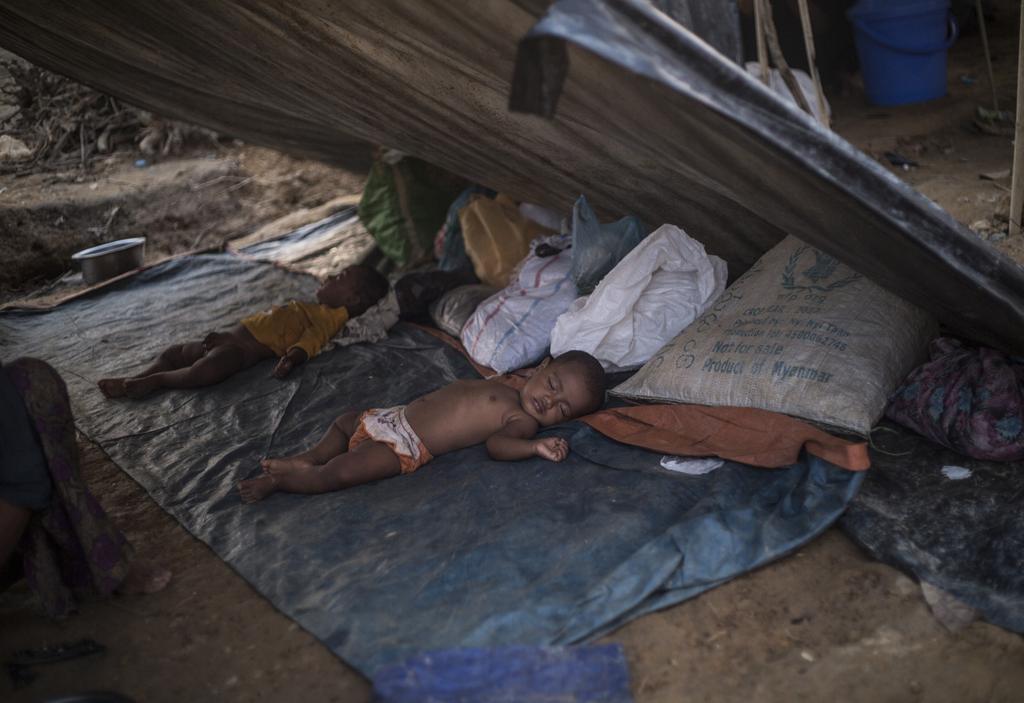 Rohingya refugee children sleep in their makeshift tent at Thankhali refugee camp.